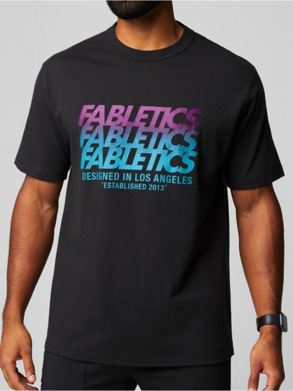 Fabletics Black Tee with Purple-to-Blue Gradient Logo